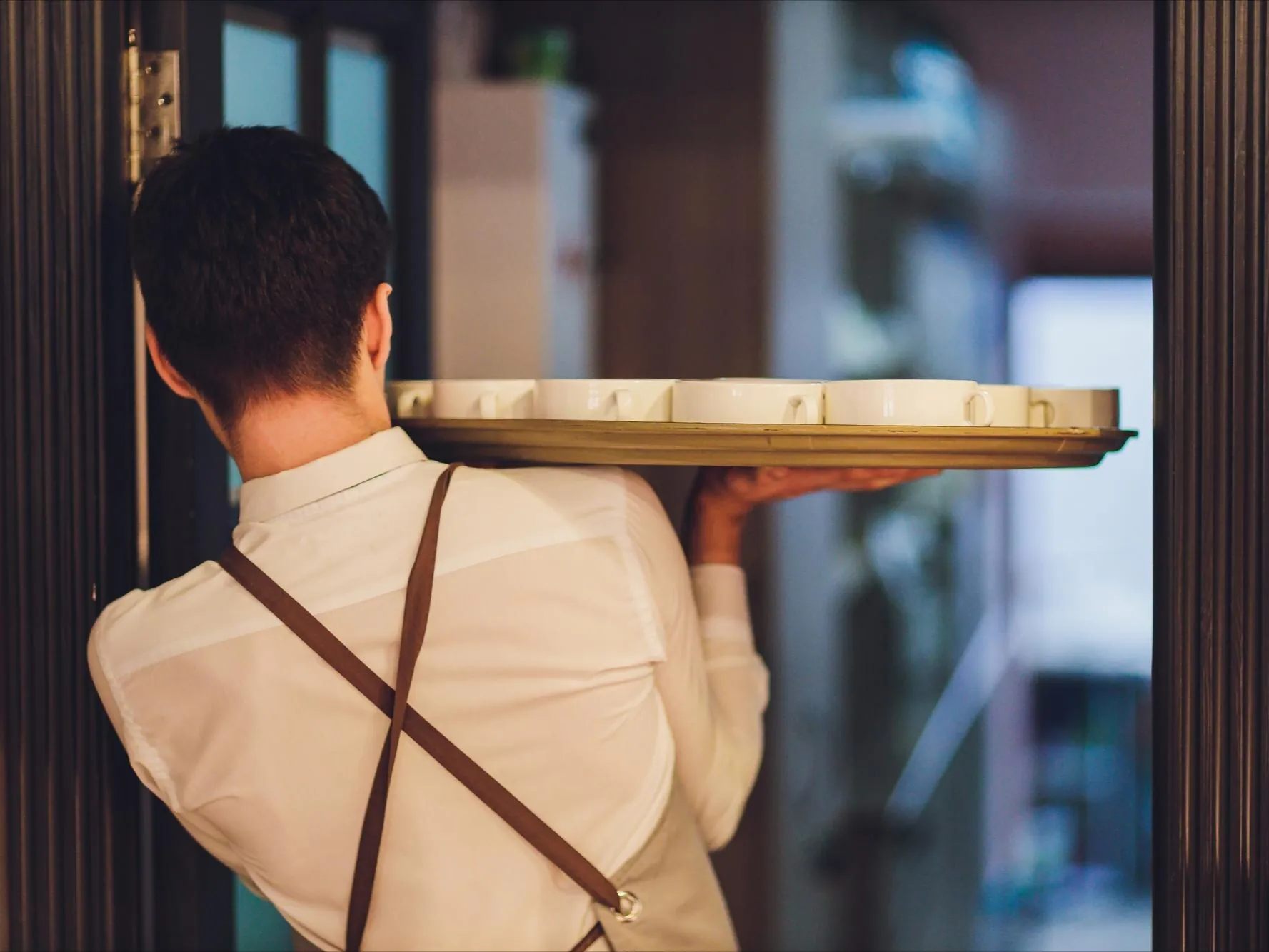 Waiter handling so many plate alone